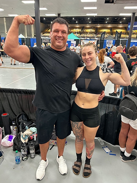 Nick Smith and Shannon Palmer flexing together.