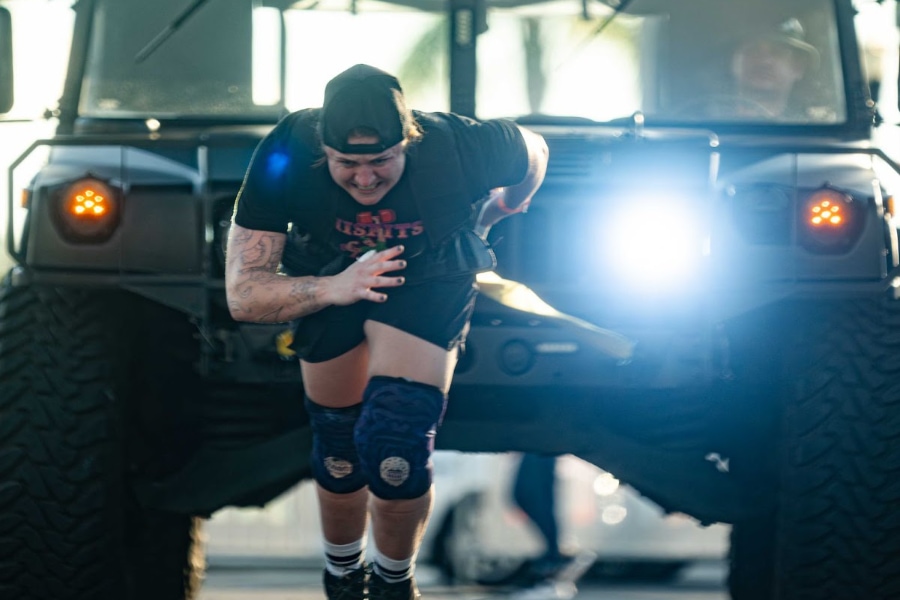 Former D1 Rowing Athlete Jordan pulling a vehicle in a strongman competition after working with Shannon Palmer
